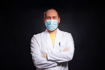 young man dressed as a laboratory assistant puts on disposable gloves - 495464939