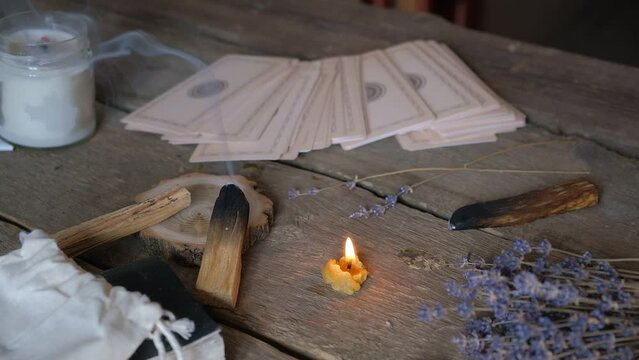 Tarot cards, Fortune telling on tarot cards magic crystal, occultism, Esoteric background. Fortune telling,tarot predictions.Fortune teller woman  tarot cards over white wooden table background.
