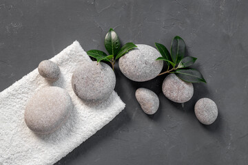 Spa stones for massage with leaves for beauty therapy