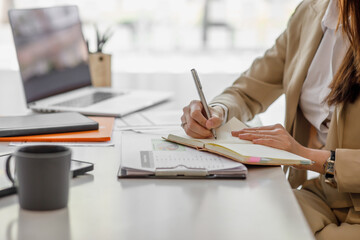 Businesswoman signing an official document, employee holding pen putting signature at paper contract agreement. Business, lawyer, finance, notary, trading, loan, work place, financial advisor concept