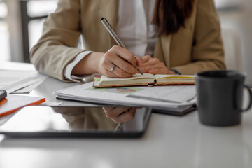 Businesswoman signing an official document, employee holding pen putting signature at paper contract agreement. Business, lawyer, finance, notary, trading, loan, work place, financial advisor concept