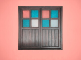 Obraz na płótnie Canvas Antique old closed wood window on wall in pastel color. Malay culture style