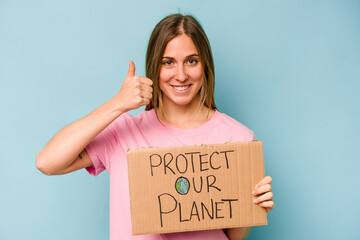 Young caucasian woman holding protect your planet placard isolated on blue background