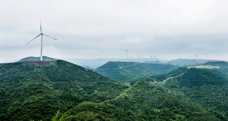 Windmills for electric power production on mountain © xy