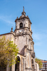 Fototapeta na wymiar Tower of the Parish of San Martin in the goiko square next to the town hall in Andoain, Gipuzkoa. Basque Country
