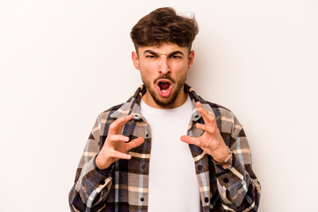 Young hispanic man isolated on white background screaming with rage.