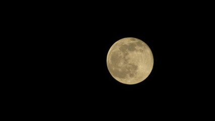 Full moon in the night sky. Black lunar background. Wallpaper with the moon