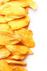 Dried mango sliced on a white background with free space