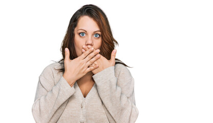 Young plus size woman wearing casual clothes shocked covering mouth with hands for mistake. secret concept.