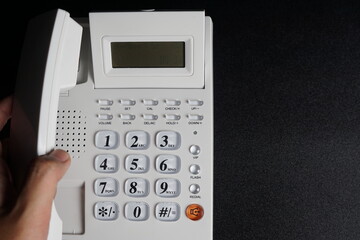 Telephone on the office desk dark