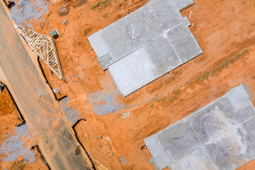 Construction site aerial views of new home concrete foundation