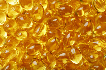 Golden Vitamin D3 Capsules close-up in full screen