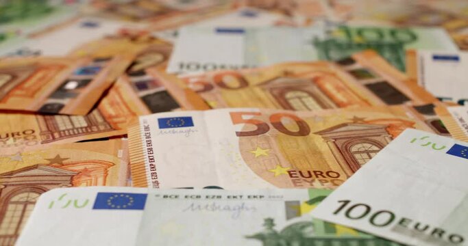 100 and 50 Euro banknotes. Closeup of Euro currency