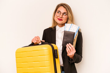 Young caucasian traveler woman holding suitcase and passport isolated on white background