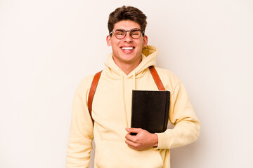 Young student caucasian man isolated on white background happy, smiling and cheerful.