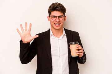 Young caucasian business man holding takeaway coffee isolated on white background smiling cheerful showing number five with fingers.