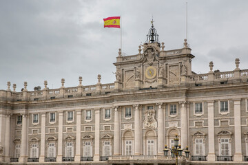 Fototapeta na wymiar Facade of the Royal Palace in Madrid, Spain. This royal residence is also called the Palace of the East. 