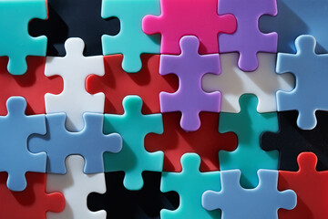 colorful jigsaw puzzle piece on red background