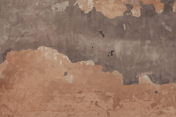 Concrete surface with grunge texture, abstract background. An old weathered wall with peeling paint.