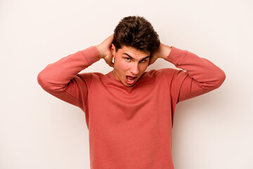 Young caucasian man isolated on white background screaming, very excited, passionate, satisfied with something.