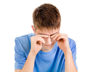Young Man rub an Eyes