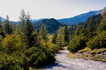 Fototapeta na wymiar A hiking trail with a panoramic view on the mountain peaks of the Hochschwab Region in Upper Styria, Austria. Alps in Europe. Journey, wilderness. Concept freedom. Sackwiesenalm, Haeuselalm