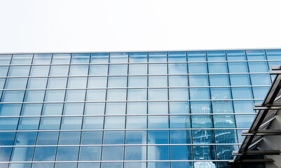 Fototapeta premium Part of modern business building against sky