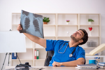 Young male doctor radiologist working in the clinic