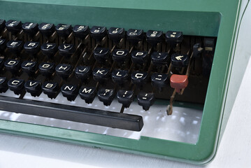 old green ribbon typewriter, object retro for decoration isolated on white background