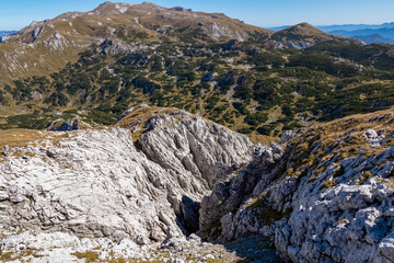 Panoramic view on the mountain peaks of the Hochschwab Region in Upper Styria, Austria. Hills overgrown with mountain pine bush, Alps in Europe. Climbing tourism, Wilderness. Concept freedom. Hiking
