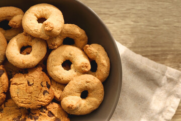 Plate of sugar cookies and chocolate chip cookies on the table. Flat lay.