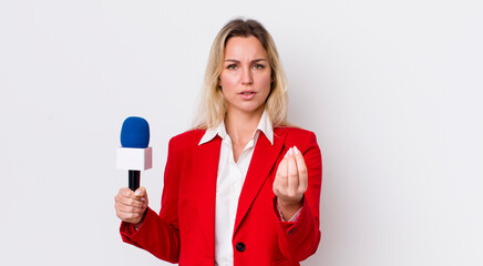 blonde pretty woman making capice or money gesture, telling you to pay. preporter and microphone...