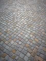 Fototapeta premium cobblestone surface of a city square. gray paved road or driveway.