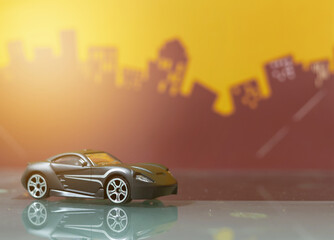 Black Sport car toy selective focus on blur city background