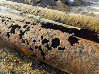 Leaky rusty metal pipes for water supply and heating