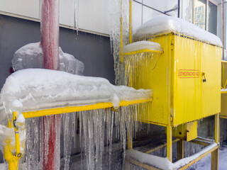 Gas cabinet distributor, overgrown with icicles