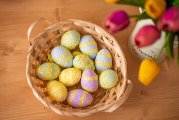 Basket with colorful Easter eggs