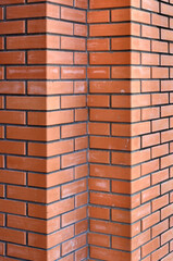 Bricks wall with different orange tones to be used as a background texture, digital graffiti or construction industry example. It is an image that shows solidity, strength, the human capacity.