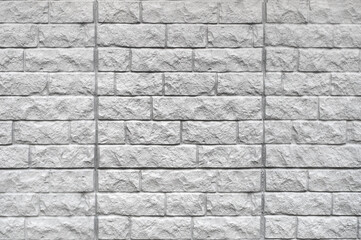 Bricks wall with different orange tones to be used as a background texture, digital graffiti or construction industry example. It is an image that shows solidity, strength, the human capacity.