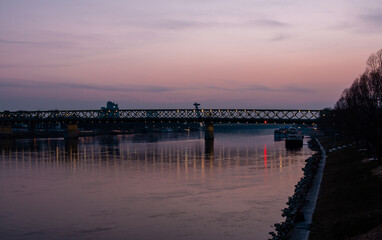 Fototapeta na wymiar Sunset view Bratislava,Slovakia with the Danube and UFO in the background