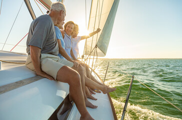 Relaxed group of senior friends sailing luxury yacht - Powered by Adobe