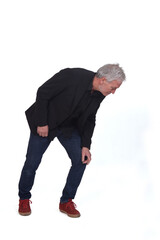 Fototapeta premium man searching on the floor on white background