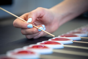Close-up, the process of making lollipops from natural ingredients.