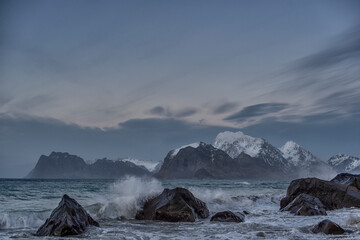 Fototapeta na wymiar Lofoten is a chain of islands far north on the coast of Norway. Lofoten is an absolutely incredible place. It's gorgeous and dramatic, with mountains growing straight out of the ice-cold waters.