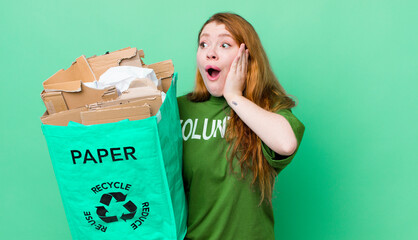 red head pretty woman feeling happy, excited and surprised. recycling concept