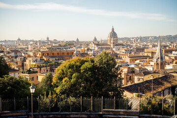 Fototapeta na wymiar Cityscape of Rome city on a sunny morning. Top view from Borghese park. Skyline of italian city