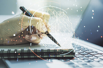 Double exposure of creative human brain microcircuit with hand writing in notepad on background...
