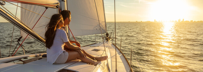 Panorama of young Hispanic couple at leisure on luxury yacht