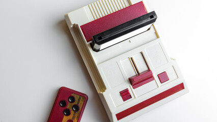 Game console with inserted cartridge and gamepads