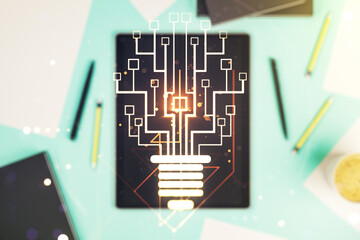 Creative idea concept with light bulb and microcircuit illustration and modern digital tablet on background, top view. Neural networks and machine learning concept. Multiexposure